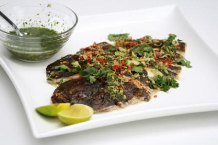 GRILLED MARINATED PENANG FISH WITH CHILLI, GARLIC AND GINGER.   SERVED WITH LEMONGRASS AND BLACK PEPPER DRESSING